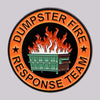 An enamel lapel pin featuring the text DUMPSTER FIRE RESPONSE TEAM in orange lettering surrounding a depiction of a green dum