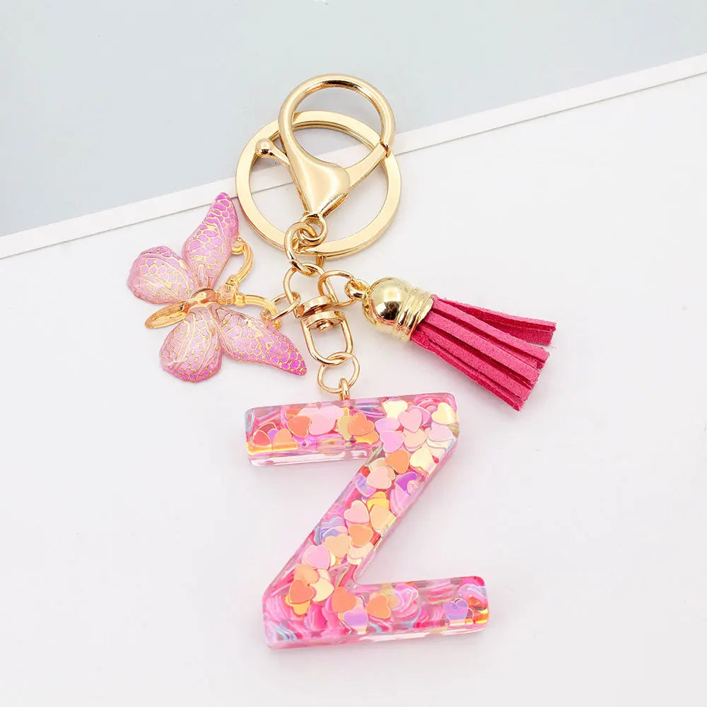 Alphabet letter Z acrylic keychain with pink butterfly charm and magenta tassel