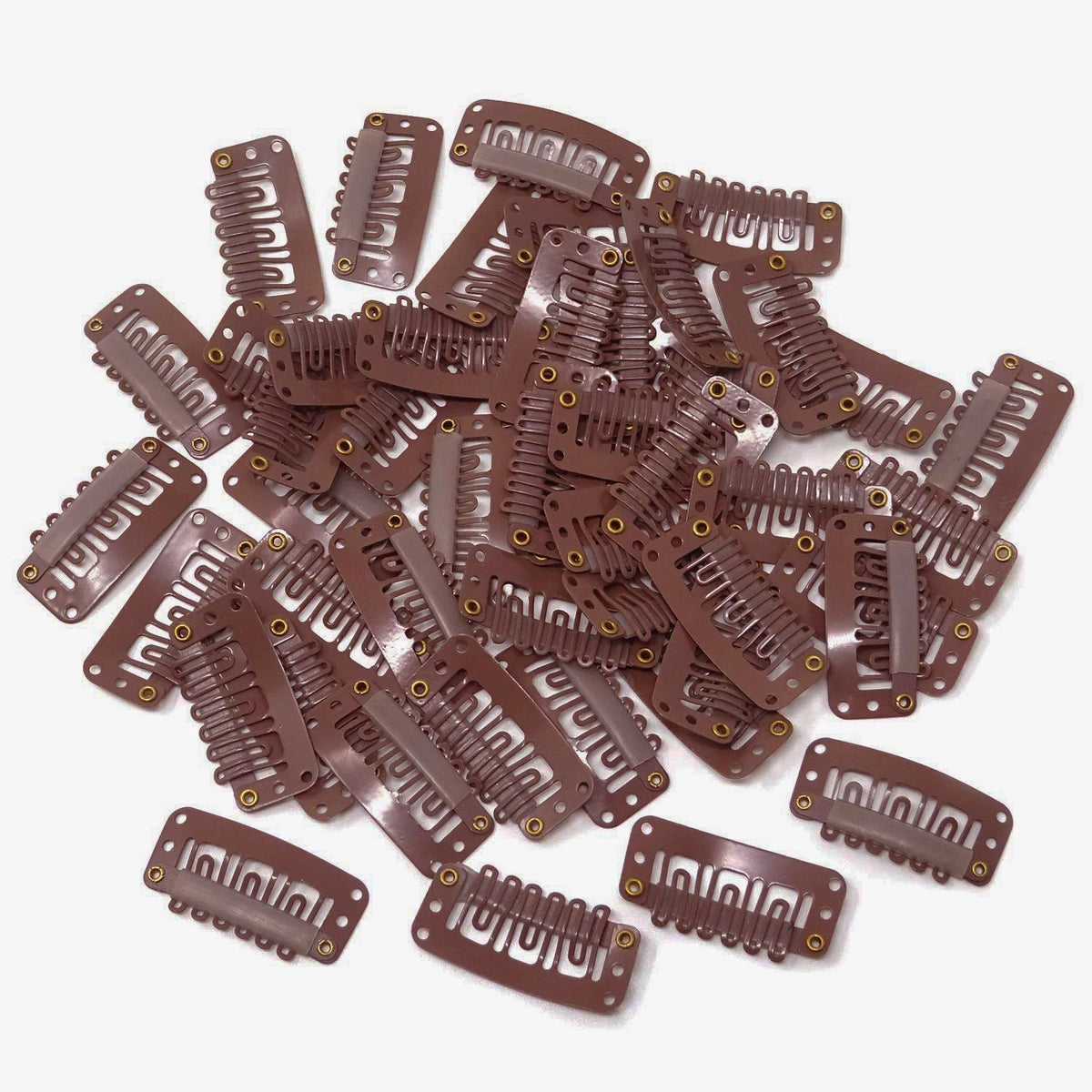 A pile of brown precision snap hair extensions for bangs.