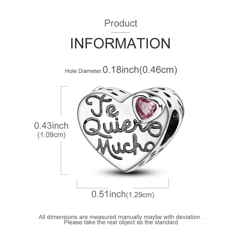 A sterling silver heart-shaped charm with the text Te Quiero Mucho engraved on it.