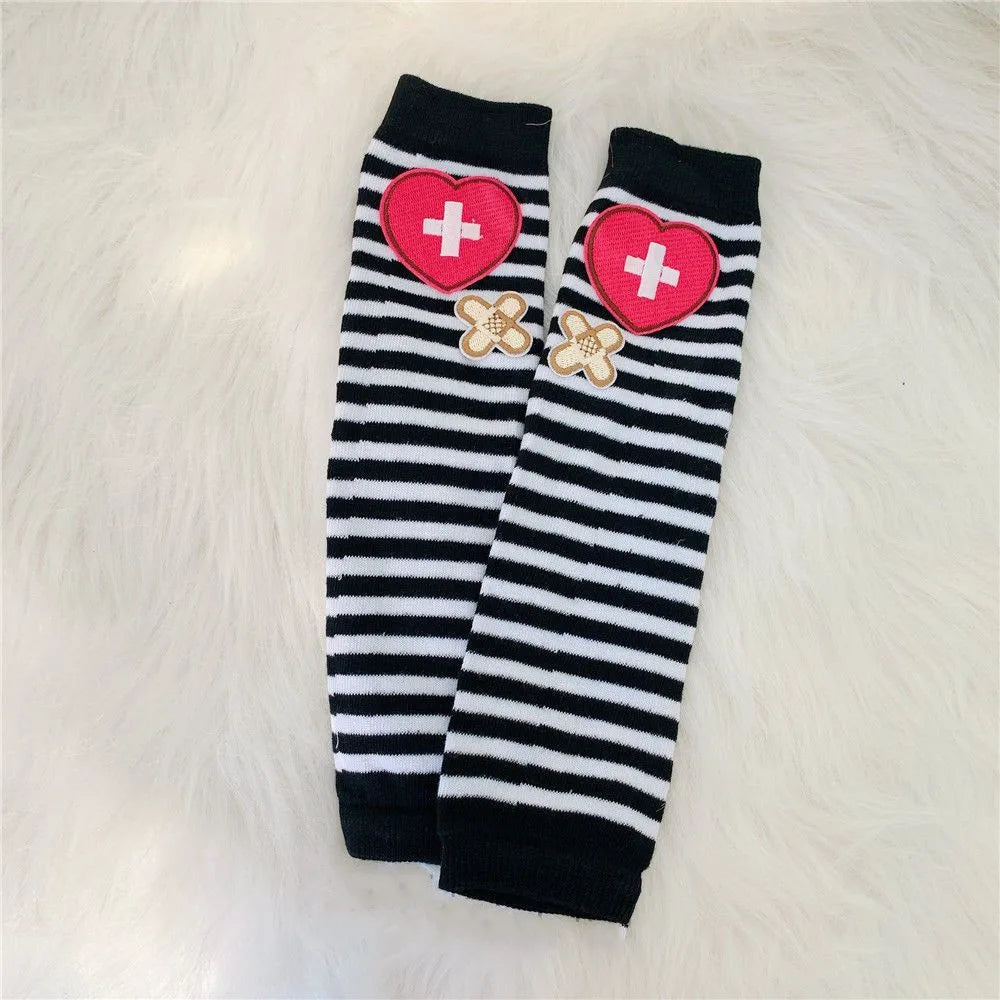 Black and white striped fingerless socks with pink heart and cross embroidery
