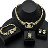 A gold heart crystal jewelry set featuring a delicate necklace and earrings displayed on a black velvet box.
