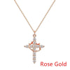 Zartes Roségold-Kreuzkette und passende Ohrringe mit klaren Zirkonsteinen.