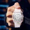 A hand holds a clear silicone watch with a luminous calendar face and metal bezel against a dark background.