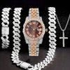 A set featuring a silver-toned watch and a matching chain necklace, both adorned with diamond accents.