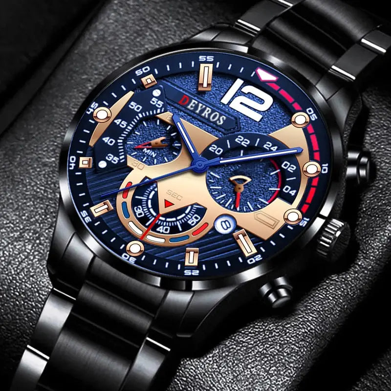 A close-up of a black men's stainless steel quartz watch with a blue dial and gold accents on a dark background.