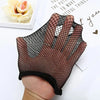 A hand is wearing a black fishnet glove or fingerless sleeve on the fingers, displayed next to a white card.