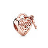 Rose gold heart-shaped charm pendant with a bail and textured design