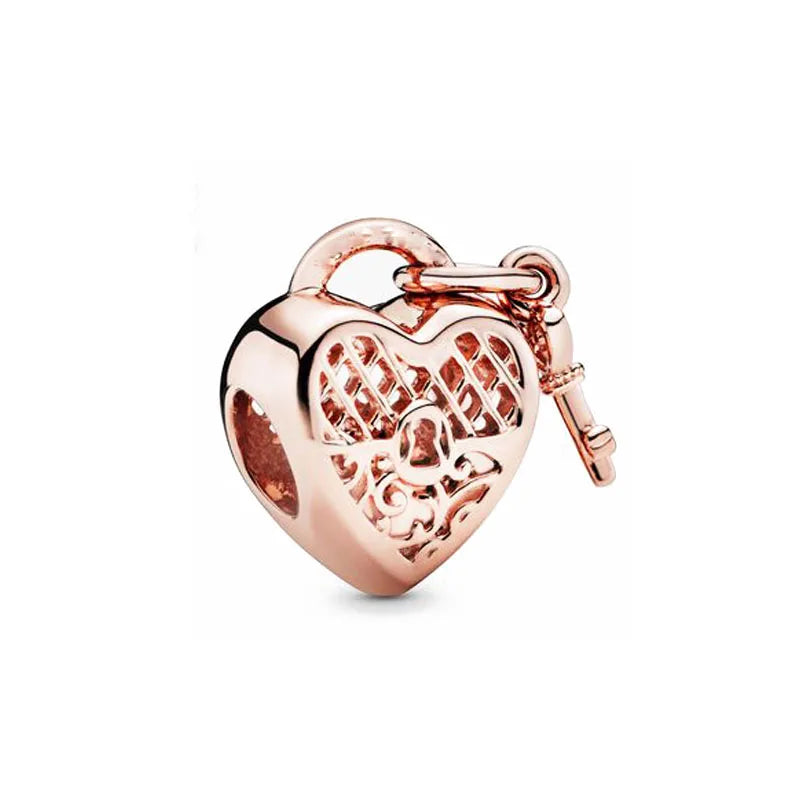 Rose gold heart-shaped charm pendant with a bail and textured design