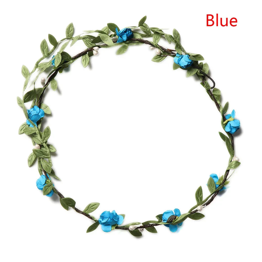 A green floral wreath with blue flowers used as a bohemian flower headband for women.
