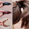 Un juego de cuatro clips para el cabello de banana en varios tonos marrones y negros