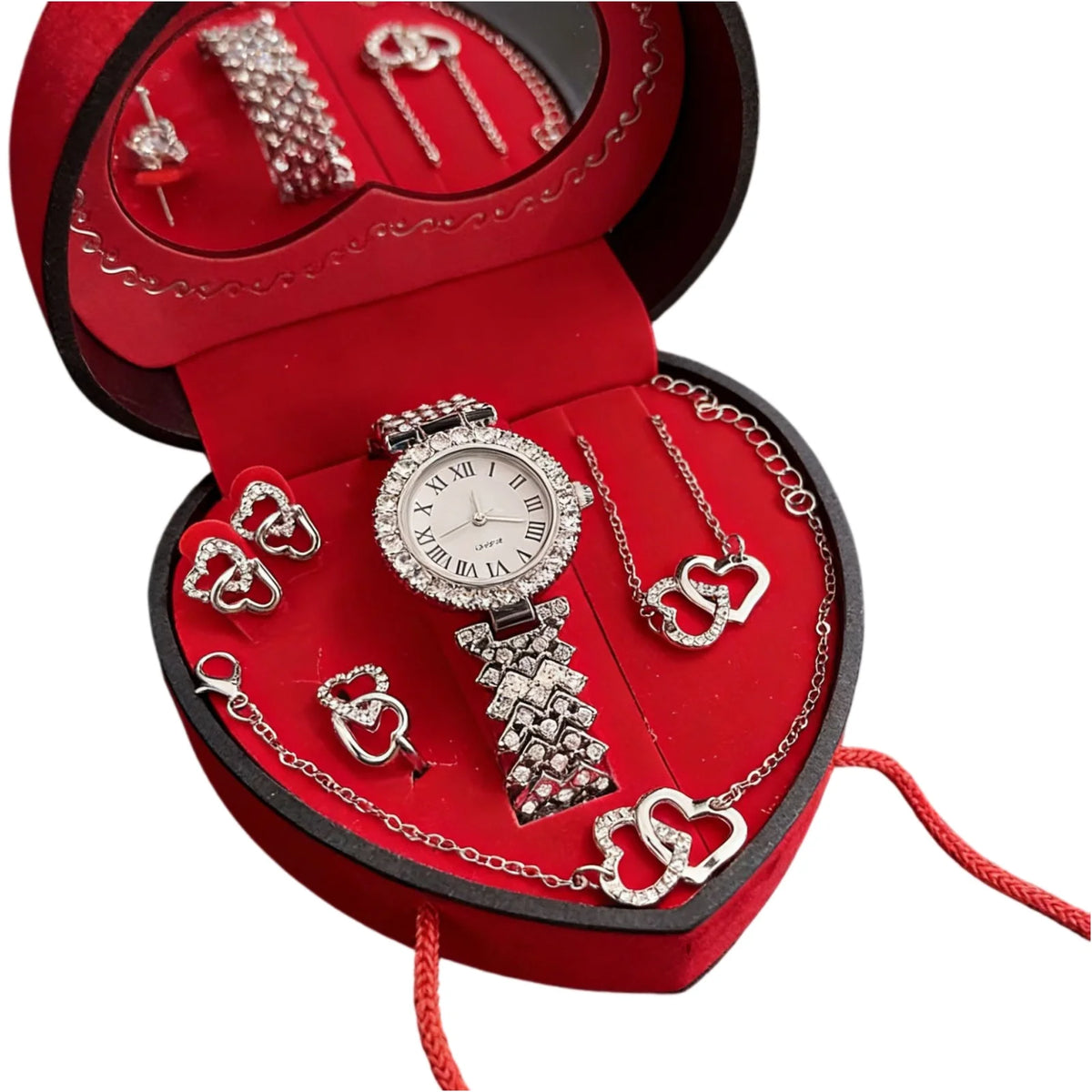 A red velvet jewelry box containing a rhinestone heart-shaped women's jewelry set including a watch and necklaces.