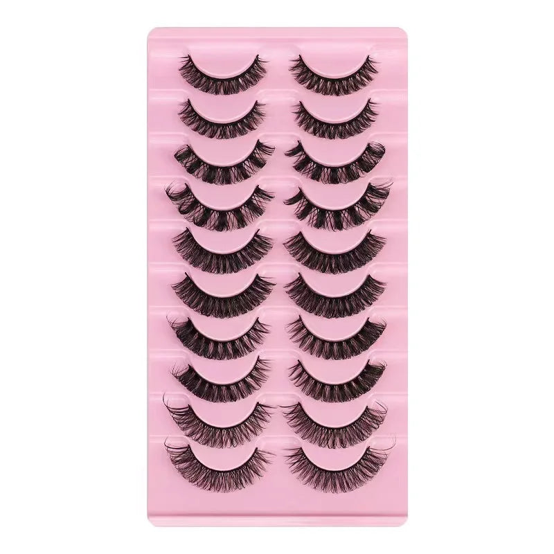 A pink plastic tray holding several rows of dramatic mink false eyelashes