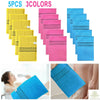 A set of five exfoliating bath washcloths in three colors pink, yellow, and blue are displayed.