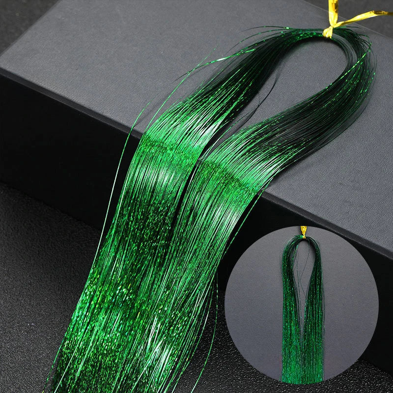 A bundle of vibrant green glitter hair extensions is displayed on a dark surface.