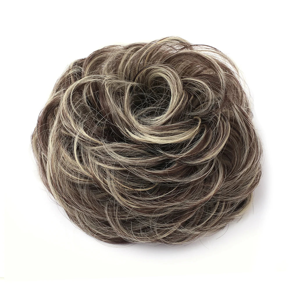A messy bun hairstyle made from dark brown and gray hair