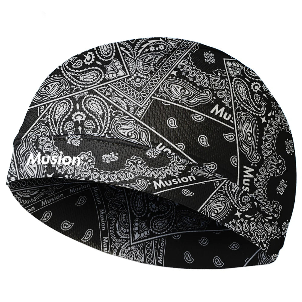 Black moisture-wicking cycling beanie cap with an intricate white paisley pattern