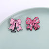 Pin de bisturí o estetoscopio con lazo rosa y diseño de cinta rosa