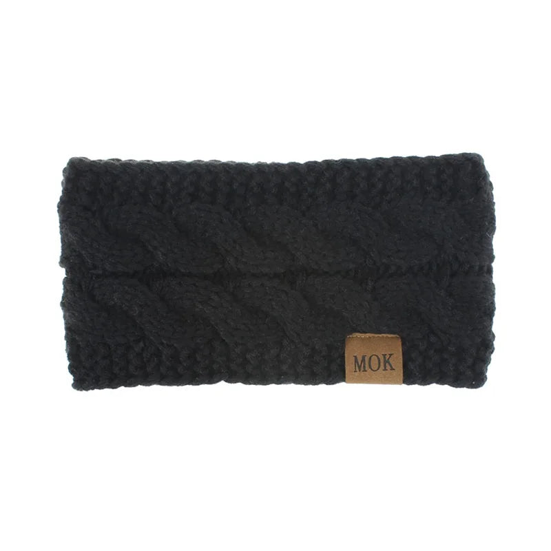 Black plush winter ear warmer headband with a wooden tag.