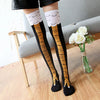 Pair of black socks with gold chicken print and white ruffled cuffs