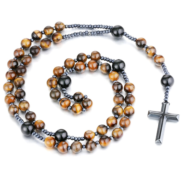 A rosary necklace made of tiger eye and black agate beads with a hematite cross pendant