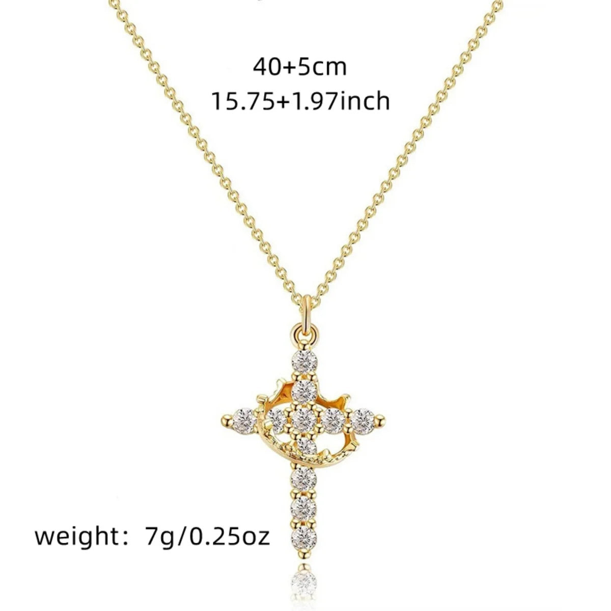 Gold-tone rotatable cross pendant necklace featuring small clear stones.