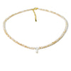 A delicate necklace made of mother of pearl beads with small crystal accents.