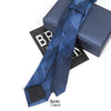 A dark blue striped skinny necktie is displayed next to its presentation box.