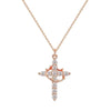 A delicate gold-tone cross pendant necklace featuring small clear stones.