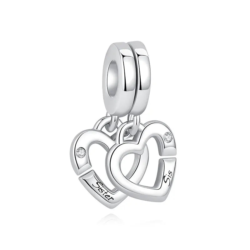 Silver family tree charm jewelry featuring stacked heart pendants