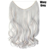 A bundle of wavy grey hair extensions displayed against a white background.