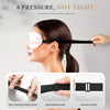 A woman is wearing a pink silk sleep mask on her face, demonstrating the product's fit and design.
