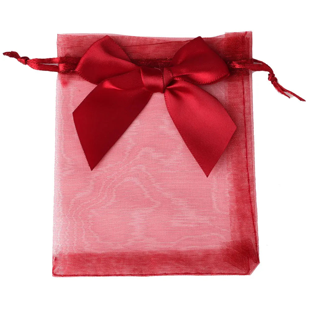 A square red organza drawstring gift bag tied with a satin red bow.