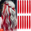 A woman with long, wavy white hair featuring vibrant red highlights and extensions.