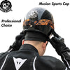 A close-up of a black and orange Musion Sports Cap being worn by a person, showing the front view of the helmet and cap.