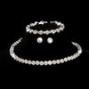 A set of four crystal jewelry pieces including a bracelet, ring, and earrings displayed against a black background.