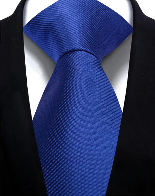 A close-up of a blue striped necktie worn against a black suit jacket.