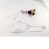 Silver crystal diamond waist belt with a pink ribbon and floral embellishments