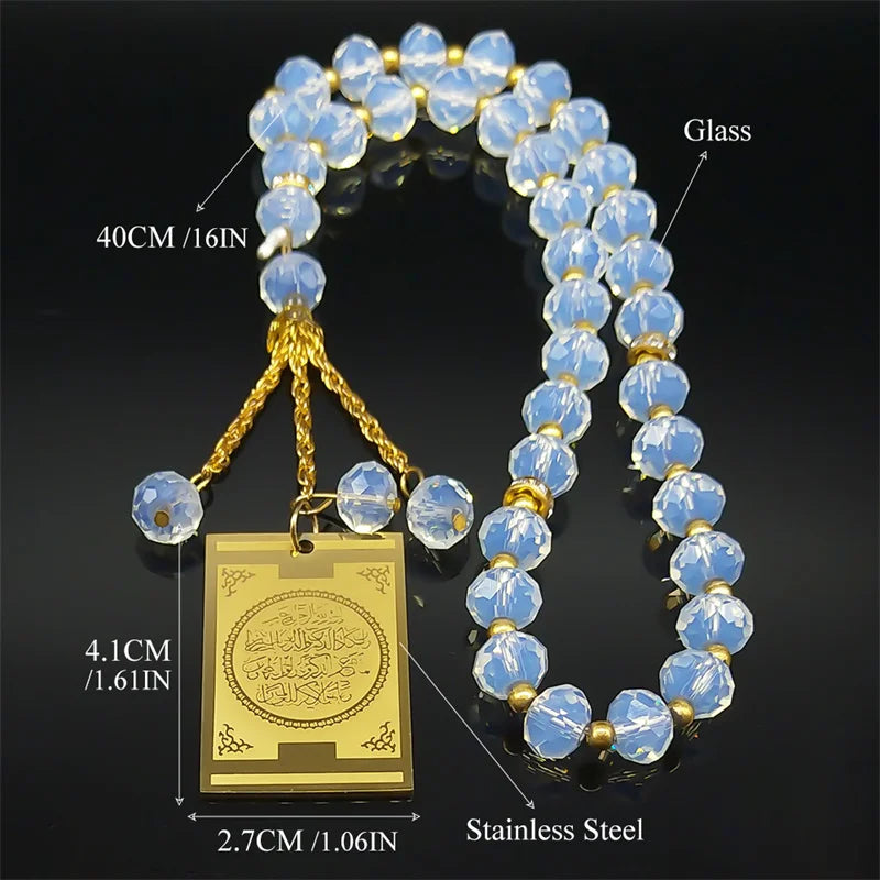 A necklace featuring blue glass beads and a gold-colored pendant on a gold chain.