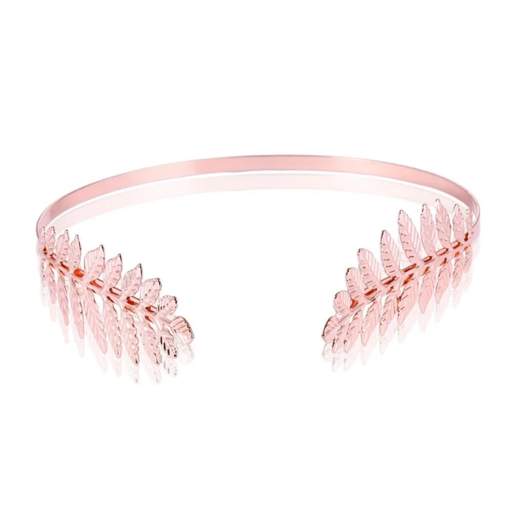 Rose gold leaf headband with delicate floral accents for bridal or party wear