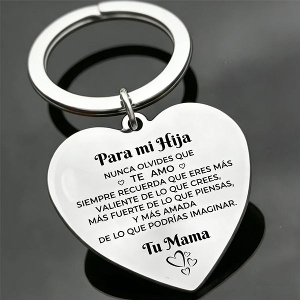 Silver heart-shaped keychain with engraved Spanish text for a child from mother to daughter