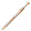 A close-up view of a gold-toned precision four-claw jewelry pick-up tool with textured handles.