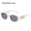 White-black gray sunglasses with gold metal detailing and white frames