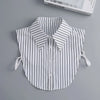 A white and black striped blouse with a false collar and detachable necklines displayed on a gray background.