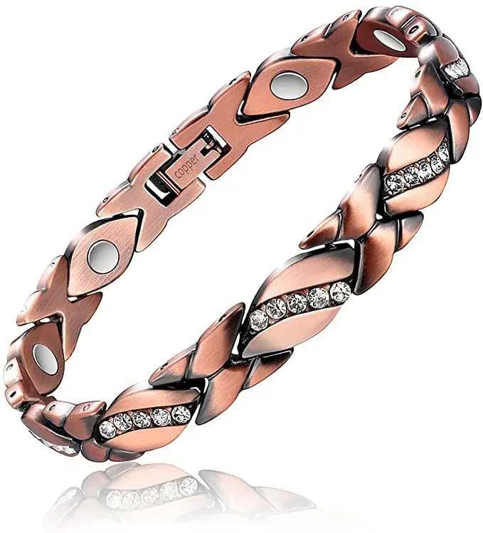 A close-up of a copper magnetic therapy bracelet with a braided design and silver accents.