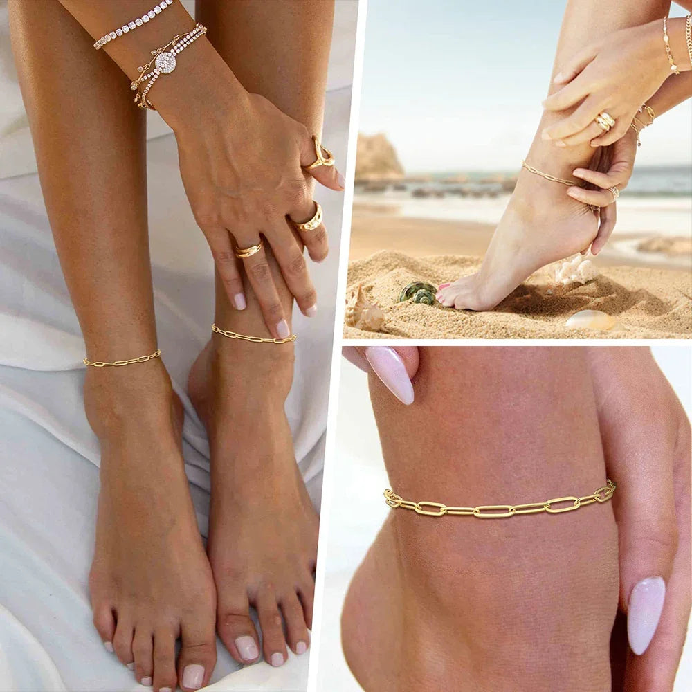 A set of three gold-toned waterproof stainless steel anklets worn on a woman's feet and wrist.