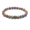 A bracelet made of polished, multicolored tiger eye lava map beads strung together.