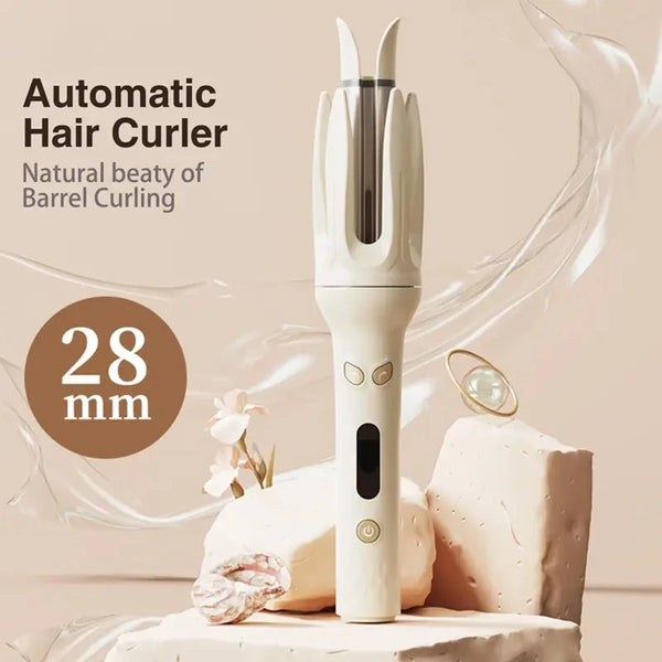 A white automatic hair curler with a barrel size of 28 mm is displayed on a light surface.
