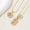 Gold necklace set featuring CZ crystal pendants shaped like the letters A and Z
