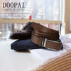 A brown leather belt with a silver automatic buckle resting on a white cloth next to a dark boot.